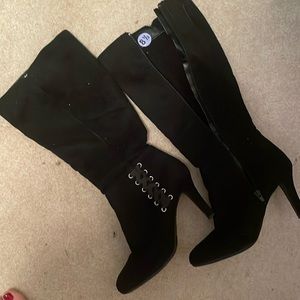 Tall black boots, with lace decorations on side side zip